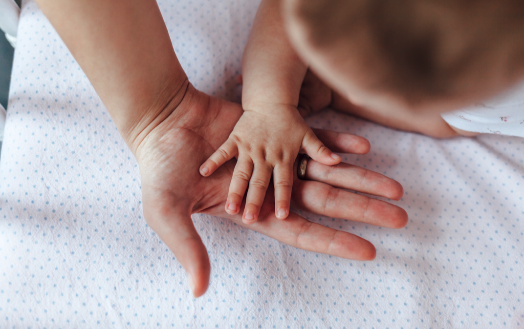 Mother and baby hands